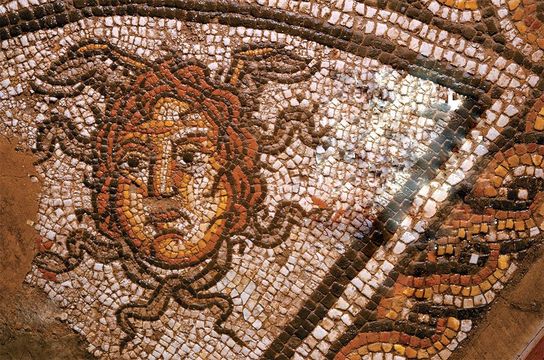 Medusa’s head is depicted in the Roman Dyer Street mosaic, reconstructed at the Corinium Museum at Cirencester.