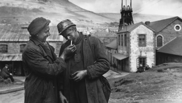 Taking a moment: Two Welsh miners pause for cigarette.