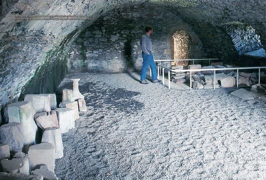 In the crypt of ancient Whithorn Priory lie the bones of the Celtic missionary St. Ninian—among the first men to bring Christianity to Scotland. Inset: A rusting anchor rests in the Whithorn sun.