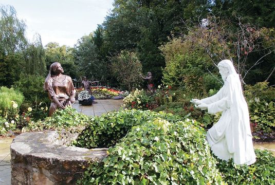 Jesus greets the Samaritan woman at the well in Elgin’s Biblical Garden.