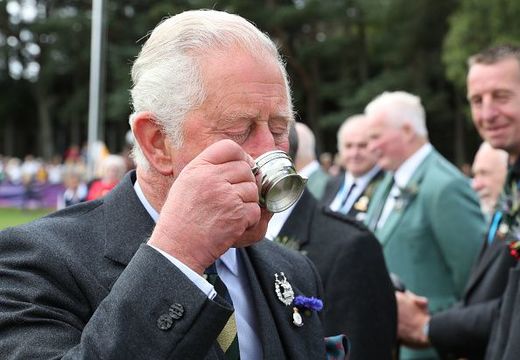 Prince Charles, Duke of Rothesay, is offered a whisky from Clan Farquharson President, Alan Caig, (not seen) as he attends the Ballater Highland Games on August 8, 2019 in Ballater, Aberdeenshire. (Photo by Andrew Milligan - WPA Pool/Getty Images)