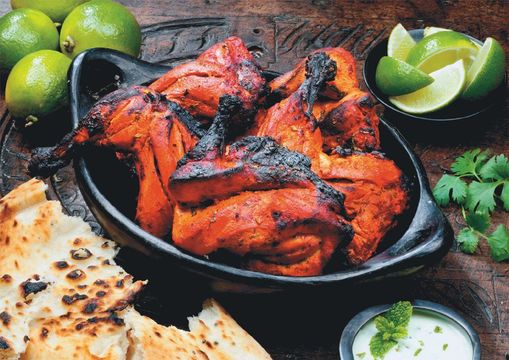 Tandoori chicken is marinated in yoghurt and spices then roasted in a clay oven called a “tandoor.”