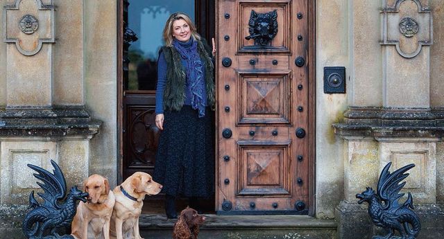 Lady Carnarvon with three of her family\'s seven dogs