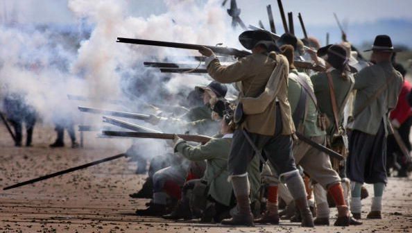 research the history of military reenactments