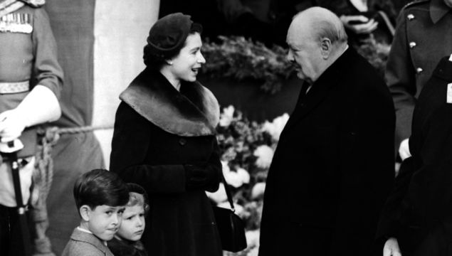 Elizabeth II, Queen of England with Prince Charles and Princess Anne chatting to Sir Winston Churchill