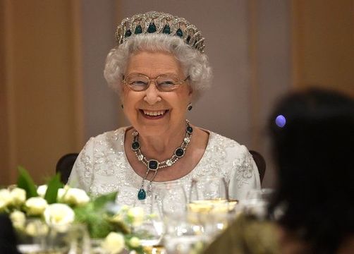 Queen Elizabeth II smiles as she attends a dinner at the Corinthia Palace Hotel in Attard in November 27, 2015.