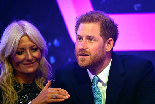 Prince Harry, Duke of Sussex reacts next to television presenter Gaby Roslin as he delivers a speech during the WellChild awards at Royal Lancaster Hotel on October 15, 2019 in London, England. (Photo by Toby Melville - WPA Pool/Getty Images)