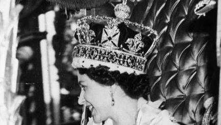 Queen Elizabeth II wearing the State Crown and carrying the State orb in a Royal carriage after her Coronation ceremony. Original Publication: Picture Post - 6537 - The Coronation Of Queen Elizabeth - pub. 1953 (Photo by Picture Post/Hulton Archive/Getty Images)