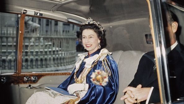 Queen Elizabeth II and Prince Philip attend a service for the Order of St Michael and St George at St Paul\'s Cathedral, London, 24th July 1968. The Queen is wearing the Star of the Order, which bears the motto \'Auspicium Melioris Aevi\'. (Photo by Hulton Archive/Getty Images)