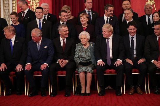 Queen Elizabeth II, German Chancellor Angela Merkel and Prime Minister Boris Johnson join other Nato leaders for a group photograph at a reception for NATO leaders hosted by Queen Elizabeth II at Buckingham Palace on December 3, 2019 in London, England. Her Majesty Queen Elizabeth II hosted the reception at Buckingham Palace for NATO Leaders to mark 70 years of the NATO Alliance. (Photo by Yui Mok - WPA Pool/Getty Images)