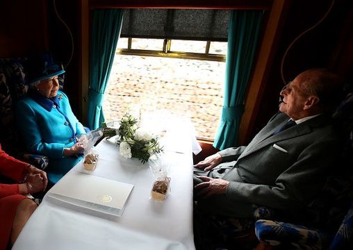 Queen Elizabeth II and Prince Philip, Duke of Edinburgh, travel on a steam train to inaugurate the new £294 million Scottish Borders Railway, on the day the Queen becomes Britain\'s longest reigning monarch, on September 9, 2015 in Tweedbank, England. (Photo by Andrew Milligan - WPA Pool/Getty Images)