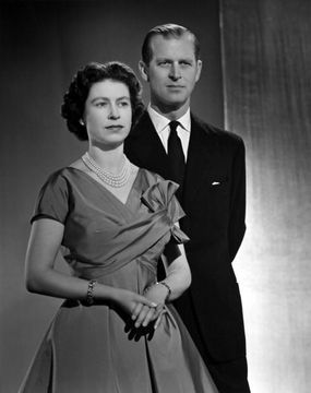 Queen Elizabeth II and Prince Philip, Duke of Edinburgh pose for a portrait at home in Buckingham Palace in December 1958 in London, England. (Photo by Donald McKague/Michael Ochs Archives/Getty Images)