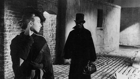 Unknown actress looking back at a man following her in a scene from the film \'Jack The Ripper\', 1959. (Photo by Paramount/Getty Images)