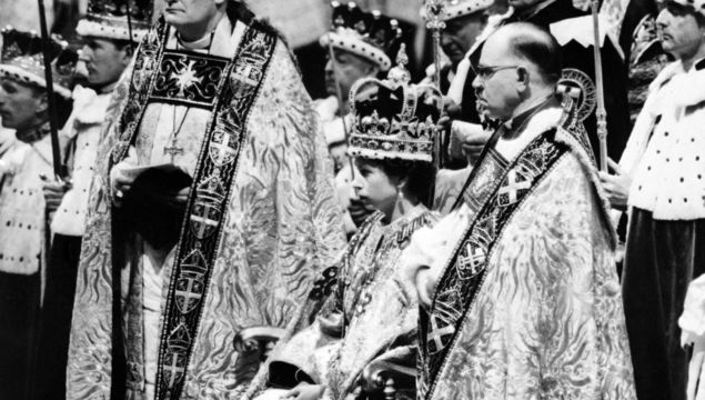 Queen Elizabeth II, surrounded by the bishop of Durham Lord Michael Ramsay (L) and the bishop of Bath and Wells Lord Harold Bradfield, receives homage and allegiance from her subjects during her coronation ceremony in Westminster Abbey.
