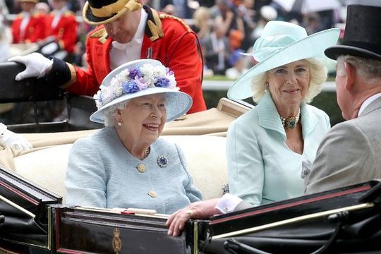 Queen Elizabeth II and Camilla, Duchess of Cornwall arrive in a horse carriage on day two of Royal Ascot at Ascot Racecourse