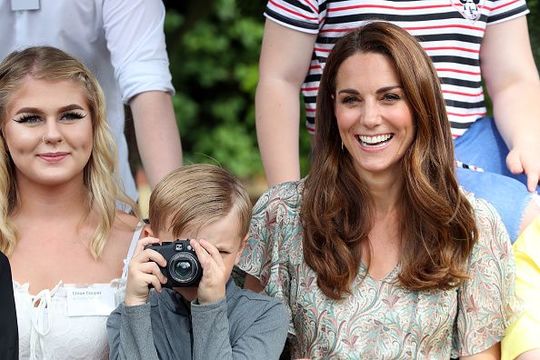 Catherine, Duchess of Cambridge and Josh Evans at photography workshop for Action for Children, run by the Royal Photographic Society