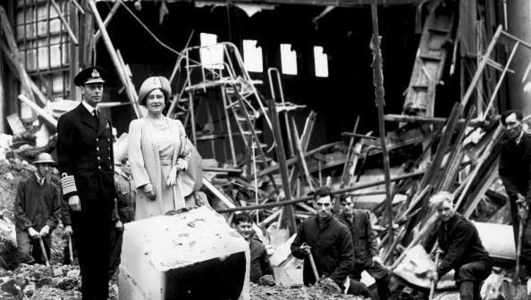 King George VI (1895 - 1952) and Queen Elizabeth (1900 - 2002) survey some of the damage after the bombing of Buckingham Palace, London, during the Second World War.
