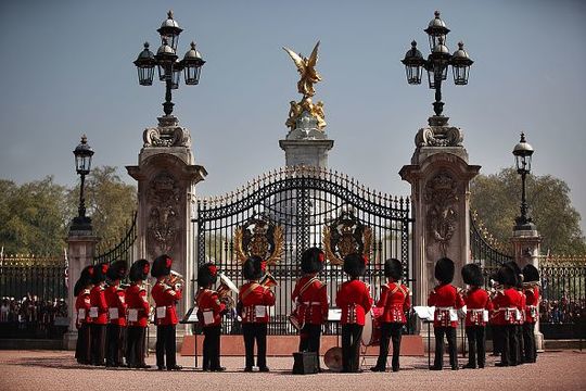  The Band of the Coldstream Guards form up around the main gate of Buckingham Palace during the Changing of the Guard ceremony on April 20, 2011 in London, England. Soldiers guard Queen Elizabeth II and other royals at Buckingham Palace in a 24 hour rotation with a ceremonial hand over at 11.30 in the morning. (Photo by Peter Macdiarmid - WPA Pool /Getty Images)