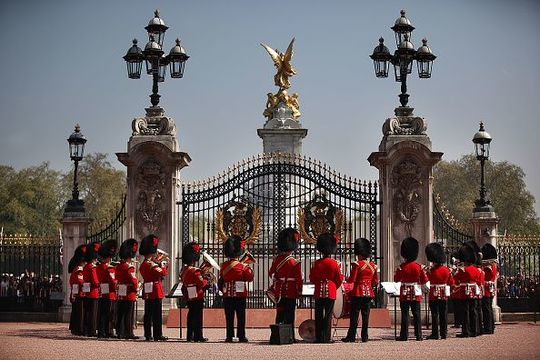 The Band of the Coldstream Guards form up around the main gate of Buckingham Palace during the Changing of the Guard ceremony on April 20, 2011 in London, England. Soldiers guard Queen Elizabeth II and other royals at Buckingham Palace in a 24 hour rotation with a ceremonial hand over at 11.30 in the morning. (Photo by Peter Macdiarmid - WPA Pool /Getty Images)