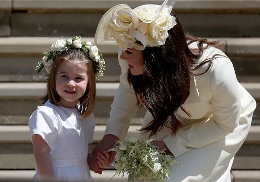 Princess Charlotte of Cambridge stands on the steps with her mother Catherine, Duchess of Cambridge after the wedding of Prince Harry and Ms. Meghan Markle at St George\'s Chapel at Windsor Castle on May 19, 2018 in Windsor, England. (Photo by Jane Barlow - WPA Pool/Getty Images)