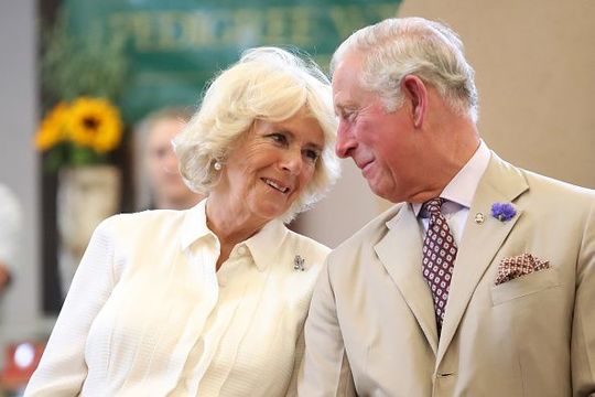 Prince Charles, Prince of Wales and Camilla, Duchess of Cornwall look at eachother as they reopen the newly-renovated Edwardian community hall The Strand Hall during day three of a visit to Wales on July 4, 2018 in Builth Wells, Wales. (Photo by Chris Jackson/Getty Images)