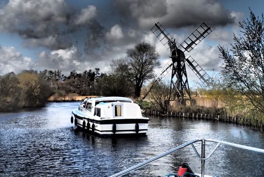 Taking a leisurely cruise on the Norfolk Broads.