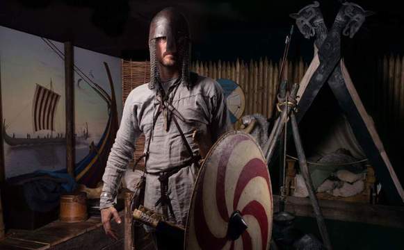 An actor at Dublinia, a Viking experience in Dublin city center, dressed as a Viking.