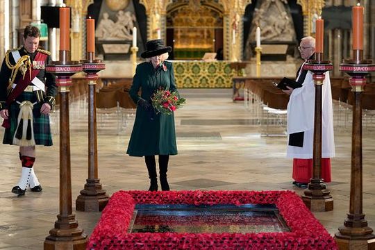 Camilla, Duchess of Cornwall, Patron of the Poppy Factory, lays flowers as she visits the Grave of the Unknown Warrior at Westminster Abbey on November 11, 2021 in Richmond, England. (Photo by Frank Augstein - WPA Pool/Getty Images)