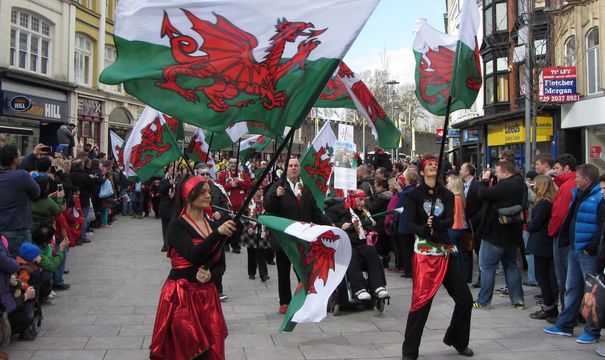 St. David\'s Day parade, Cardiff. A riot of Welsh flags is seen on St. John Street, in 2014.