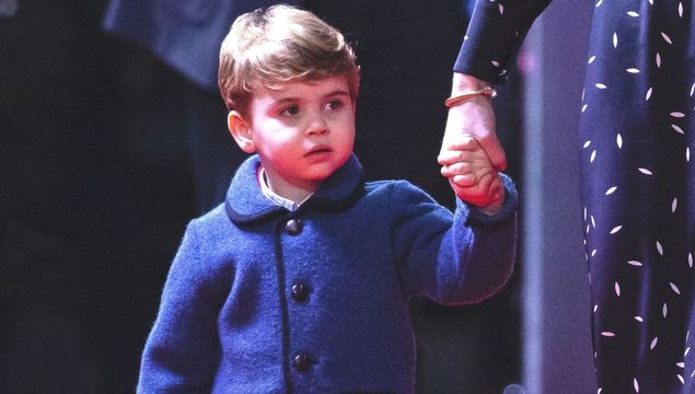 Prince Louis holding his mother Kate Middleton\'s hand at the London Palladium in Dec 2020.