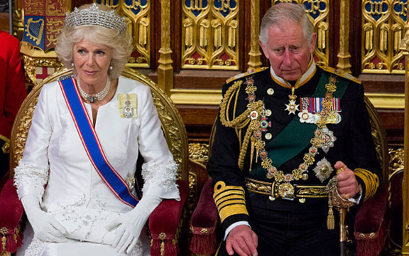 Prince Charles, Prince of Wales and Camilla, Duchess of Cornwall sit as Queen Elizabeth II delivers the Queen\'s Speech from the throne during State Opening of Parliament in the House of Lords at the Palace of Westminster on May 18, 2016 in London, England.
