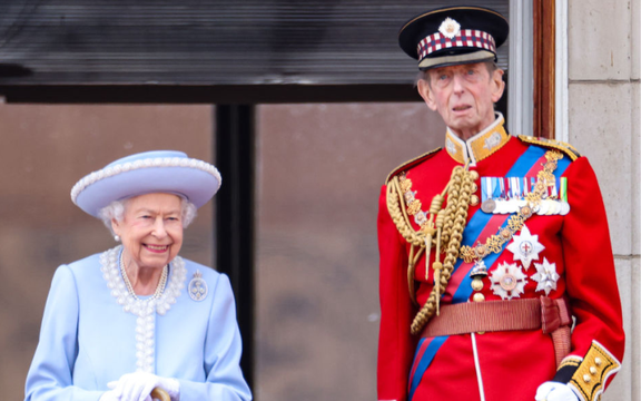 Queen Elizabeth II and Prince Edward, Duke of Kent watch from the balcony at Buckingham Palace for the Trooping the Colour ceremony parade on June 2, 2022 in London