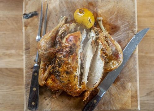 Roast chicken cooked with lemon and garlic.