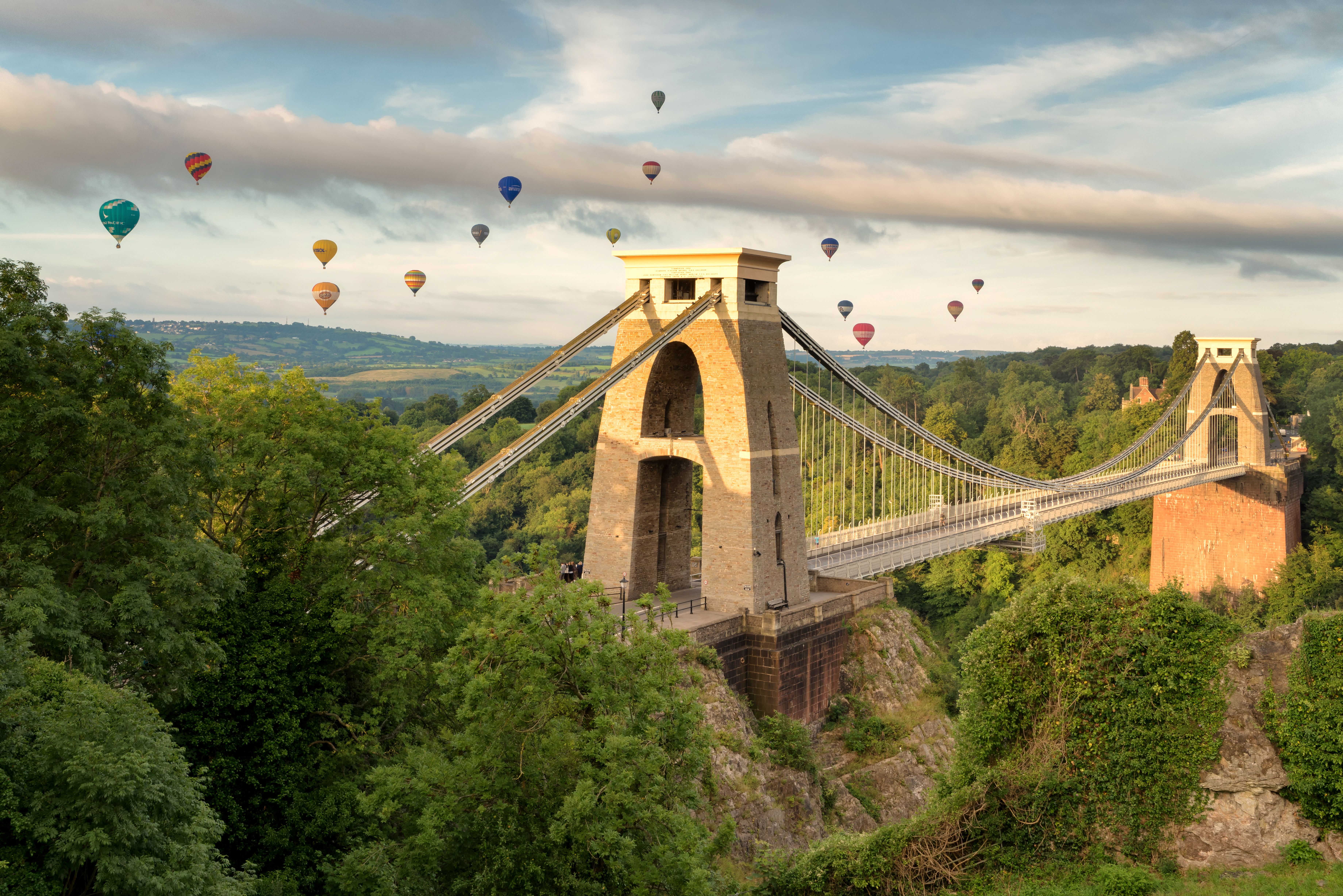 The Clifton Suspension Bridge, taken at sunrise with Hot Air Balloons drifting in the distance
