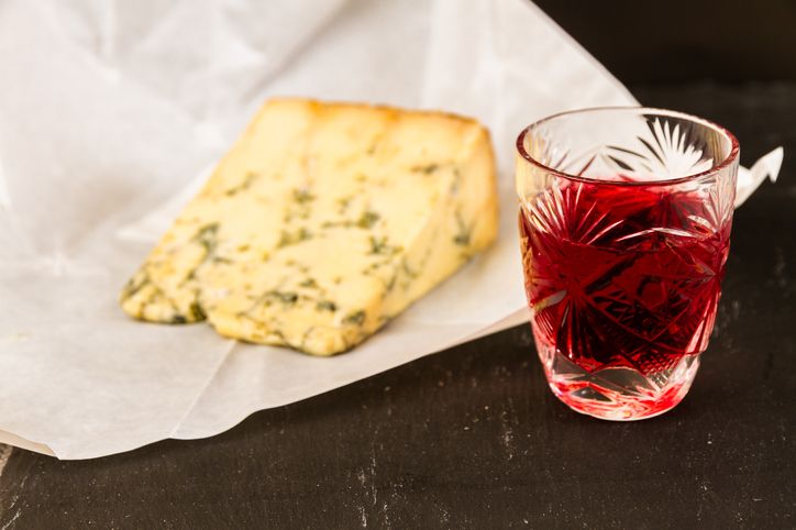 Glass of sloe gin with cheese