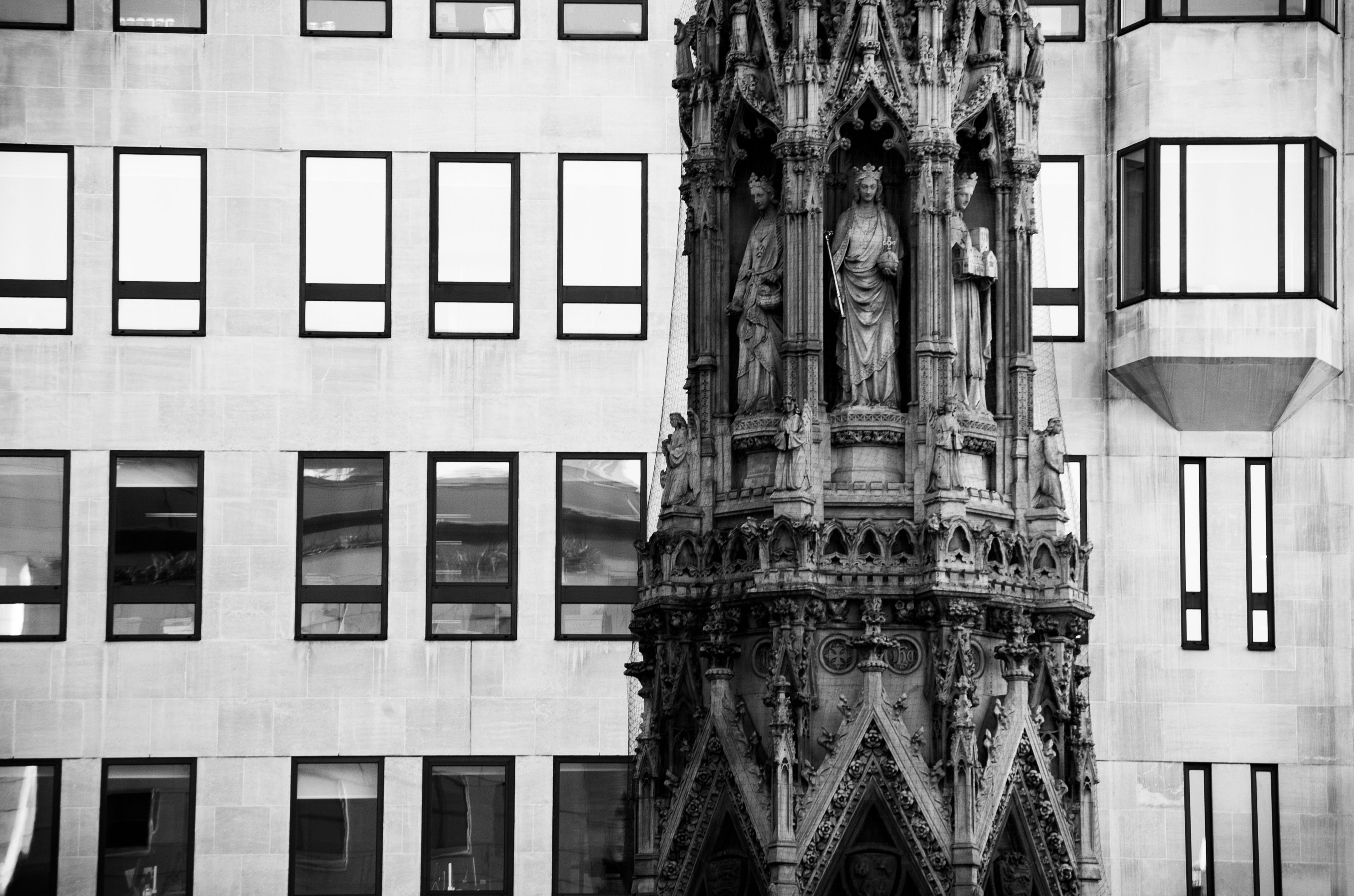 Close-up photo of the restored Eleanor's Cross outside the Charing Cross station in London, UK.