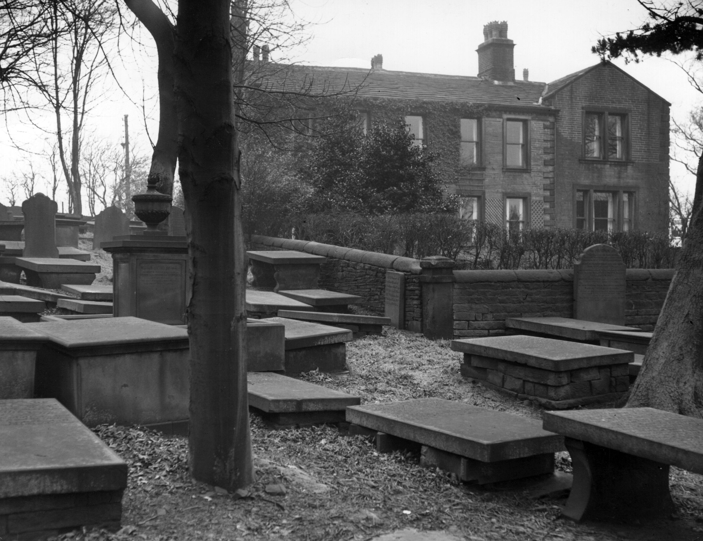 Circa 1940: The Parsonage in Haworth, North Yorkshire, home of the Bronte family, seen from the graveyard. (Photo by Val Doone/Getty Images)