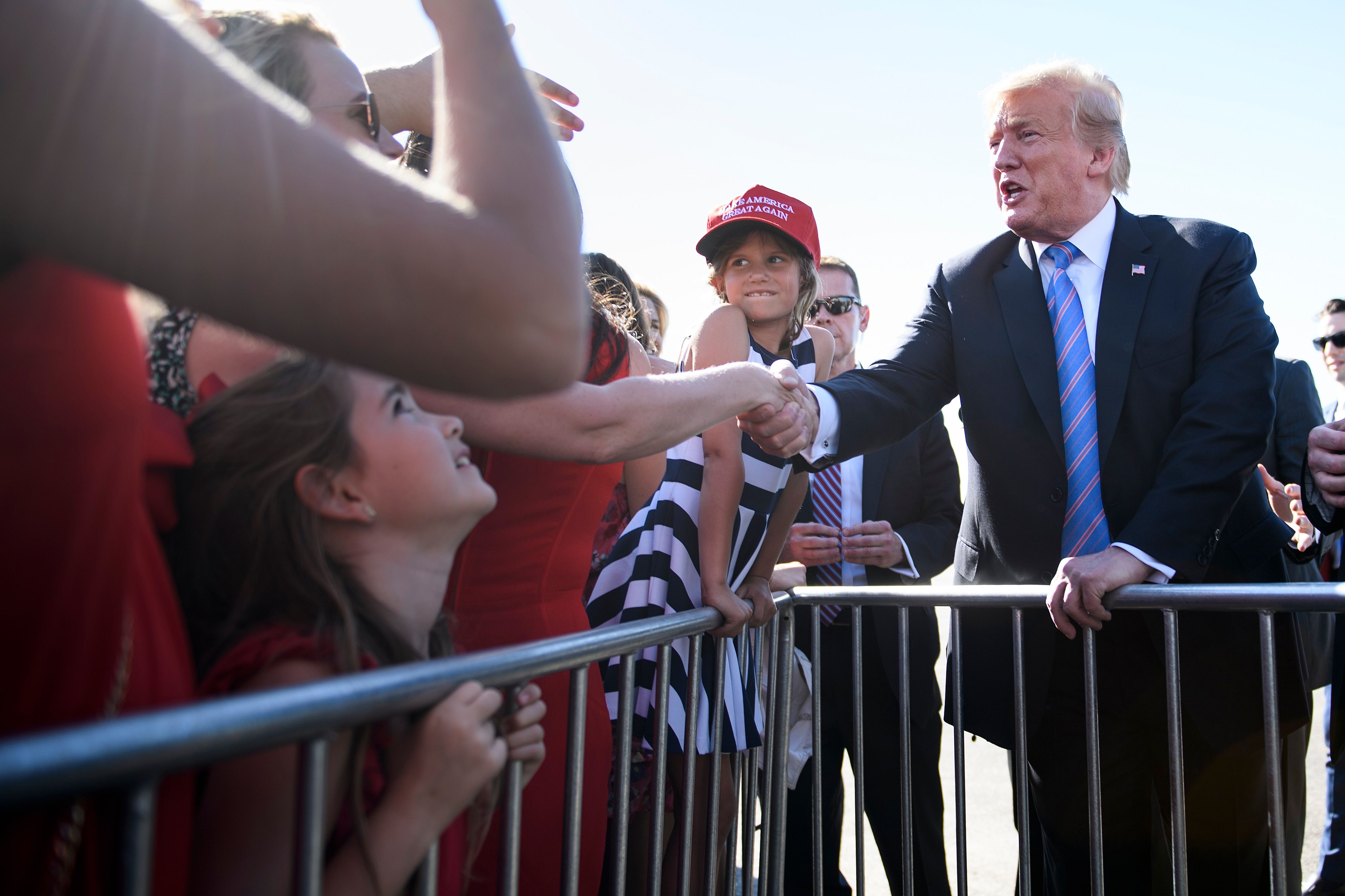 US President Donald Trump greets supporters as he arrives at Louis Armstrong New Orleans International Airport on May 14, 2019 in Kenner, Louisiana