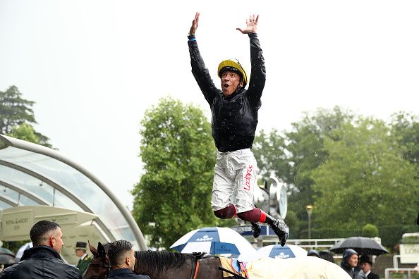Frankie Dettori makes a flying dismount from Crystal Ocean after winning The Prince of Wales's Stakes on day two of Royal Ascot at Ascot Racecourse