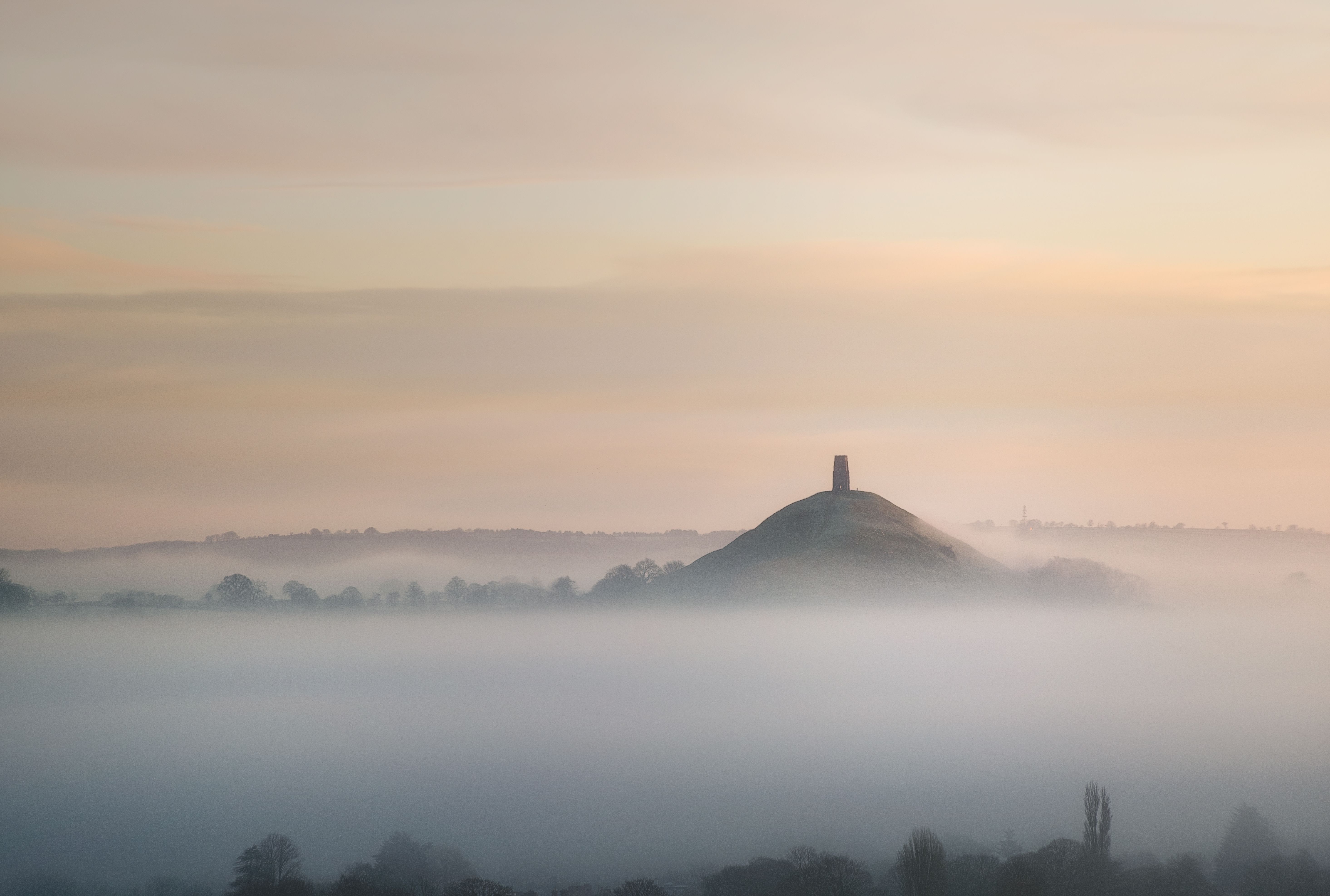 Misty winter scenery of iconic Somerset landmark - Glastonbury Tor