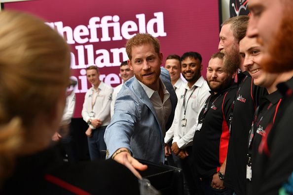 Prince Harry, Duke of Sussex speaks to students and staff involved in the SHU Racing Team project during a visit to Sheffield Hallam University
