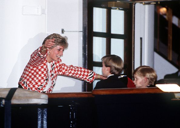 The Princess of Wales greets her sons Prince William and Prince Harry on the deck of the yacht Britannia in Toronto, when they joined their parents on an official visit to Canada, 23rd October 1991. The Princess is wearing a Moschino suit. (Photo by Jayne Fincher/Princess Diana Archive/Getty Images)