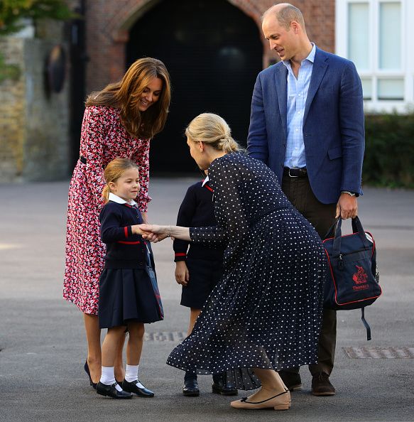 Helen Haslem, head of the lower school greets Princess Charlotte as she arrives for her first day of school, with her brother Prince George (hidden) and her parents the Duke and Duchess of Cambridge, at Thomas's Battersea in London on September 5, 2019 in London, England. (Photo by Aaron Chown - WPA Pool/Getty Images)