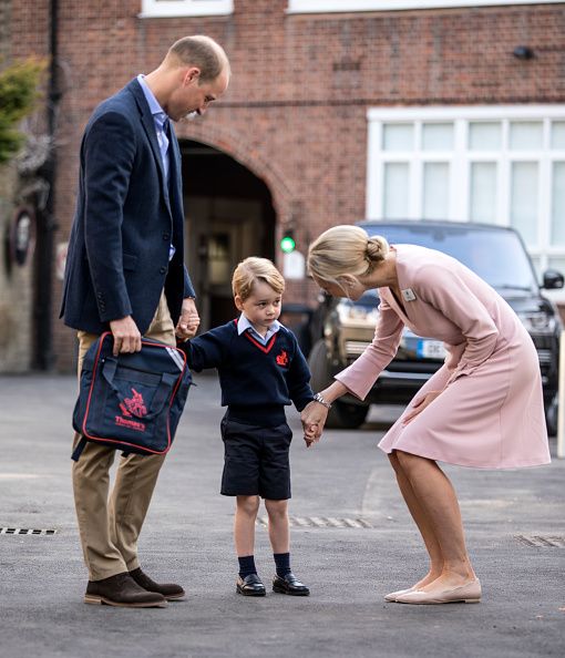 Prince George of Cambridge arrives for his first day of school with his father Prince William, Duke of Cambridge as they are met Head of the lower school Helen Haslem at Thomas's Battersea on September 7, 2017 in London, England. (Photo by Richard Pohle - WPA Pool/Getty Images)
