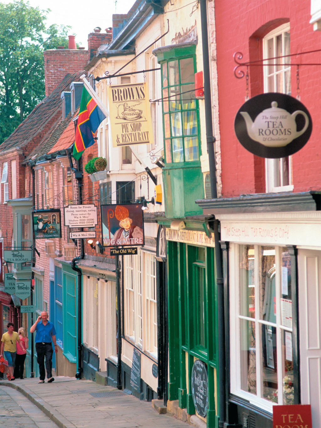 Between the more modern city center and the medieval cathedral precincts and castle above, Steep Hill is lined with charming shops. JON ARNOLD IMAGES LTD/ALAMY Between the more modern city center and the medieval cathedral precincts and castle above, Steep Hill is lined with charming shops. JON ARNOLD IMAGES LTD/ALAMY