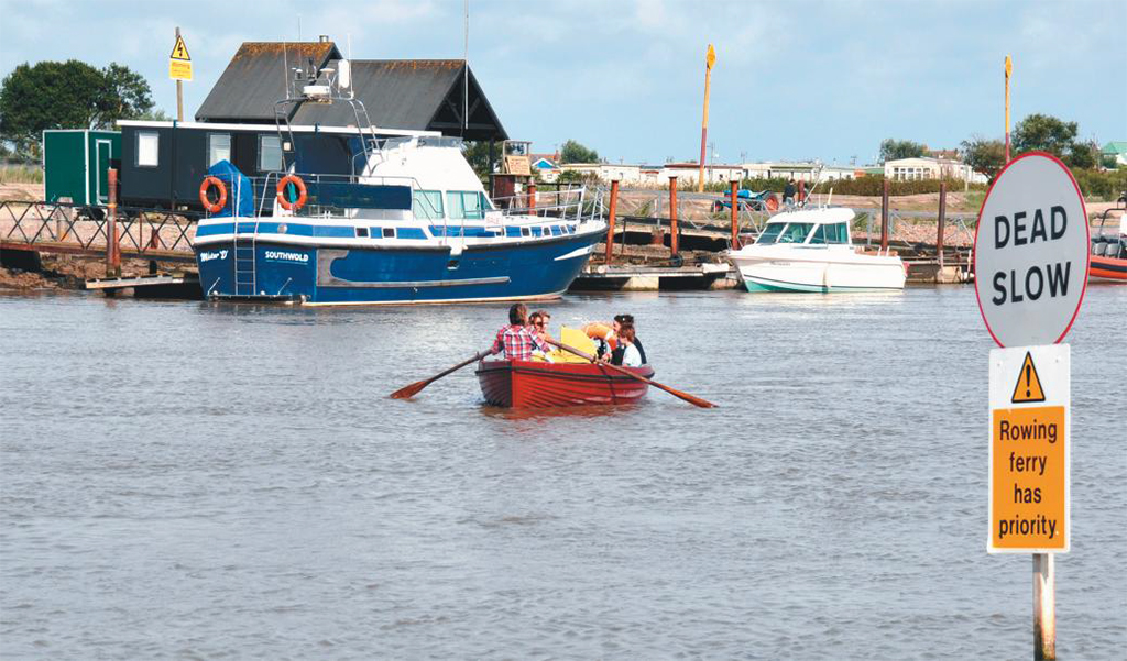 Visitors are rowed by ferry across the river from Southwold to the tearooms, shops and pubs of Walberswick