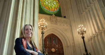 Stunning Site-Specific Artwork installed in St. Stephen’s Hall in the Houses of Parliament commemorates women’s suffrage A woman standing in front of a building